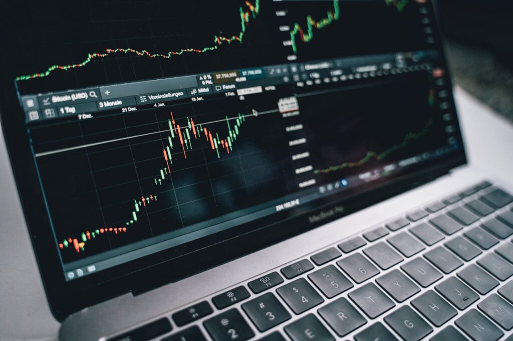 pexels-photo-6770609 Close-up of a financial graph on a laptop screen, depicting stock market analysis in Berlin.